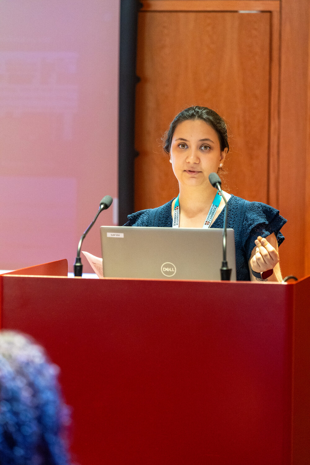 Woman at lectern with laptop