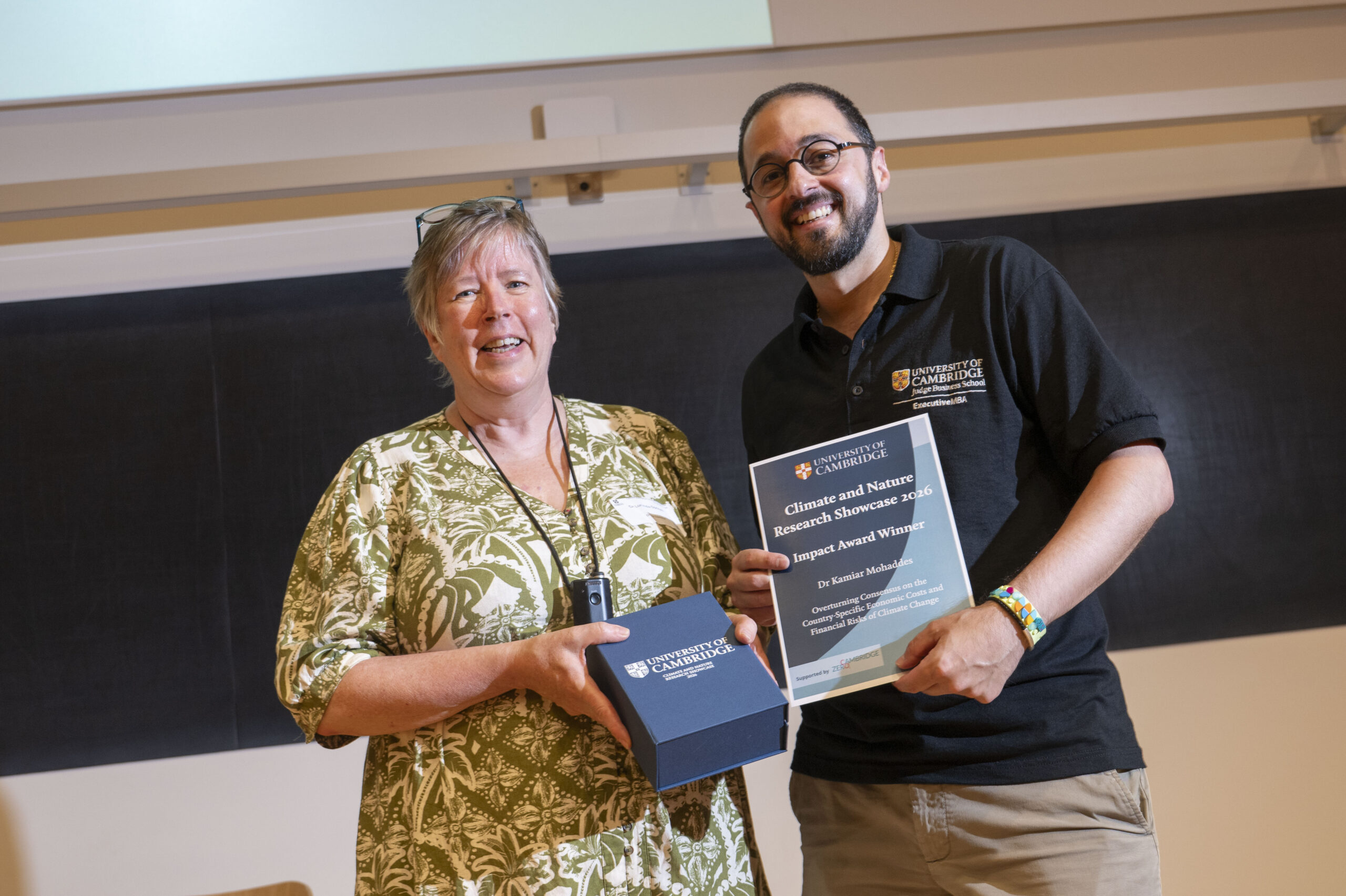 Man receives award from woman