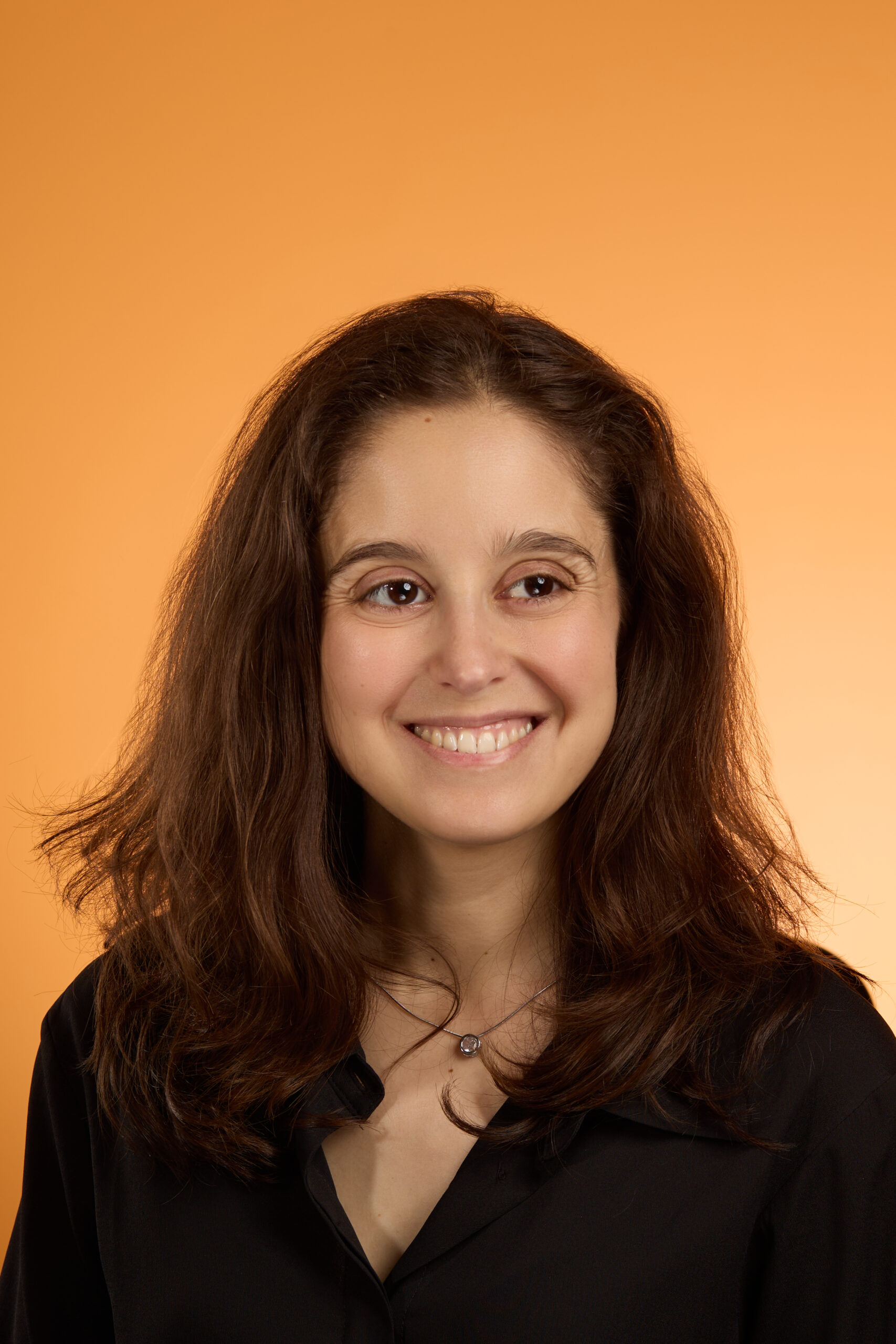 Woman's face against orange background