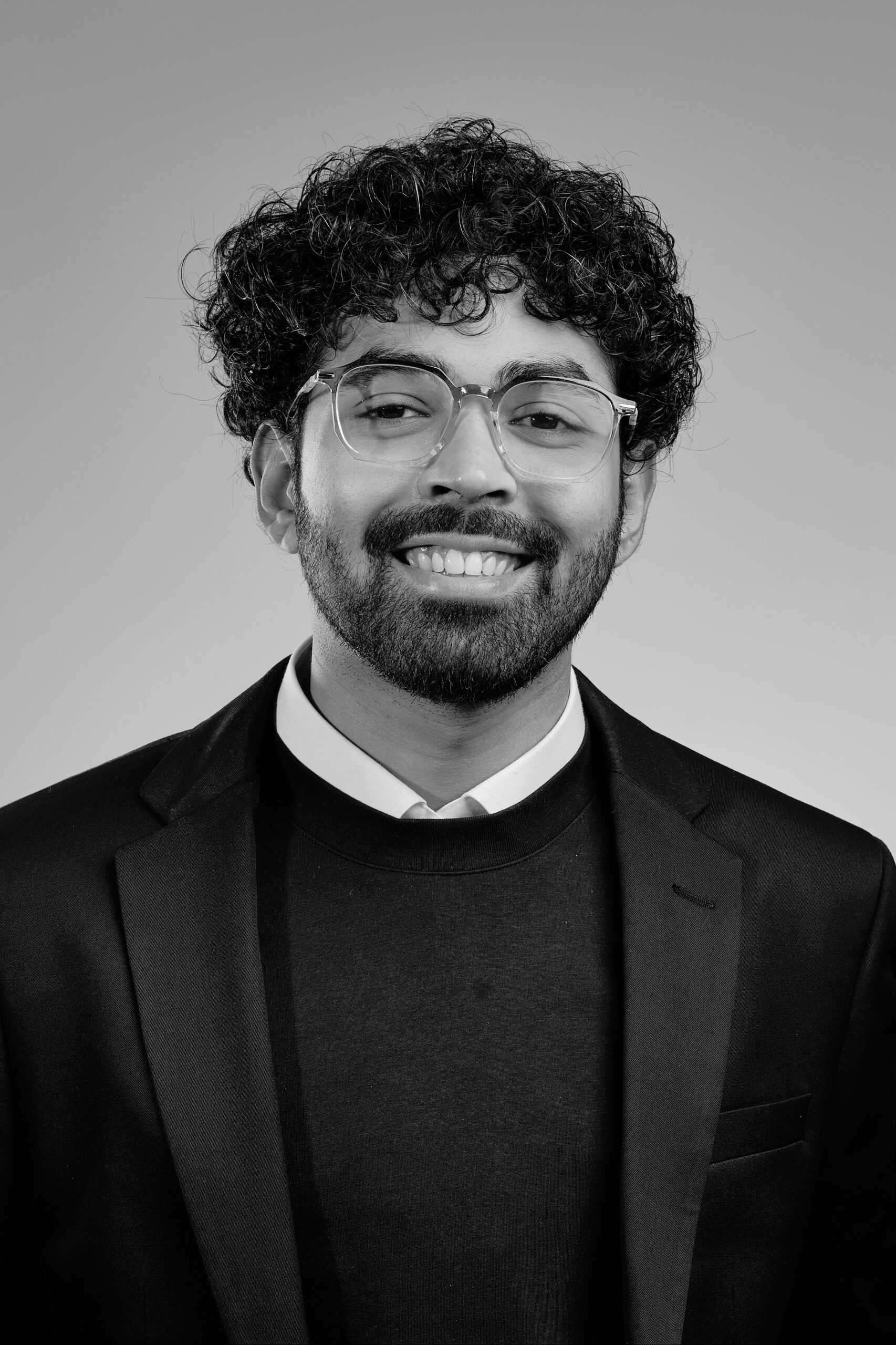 Man with beard and glasses smiling
