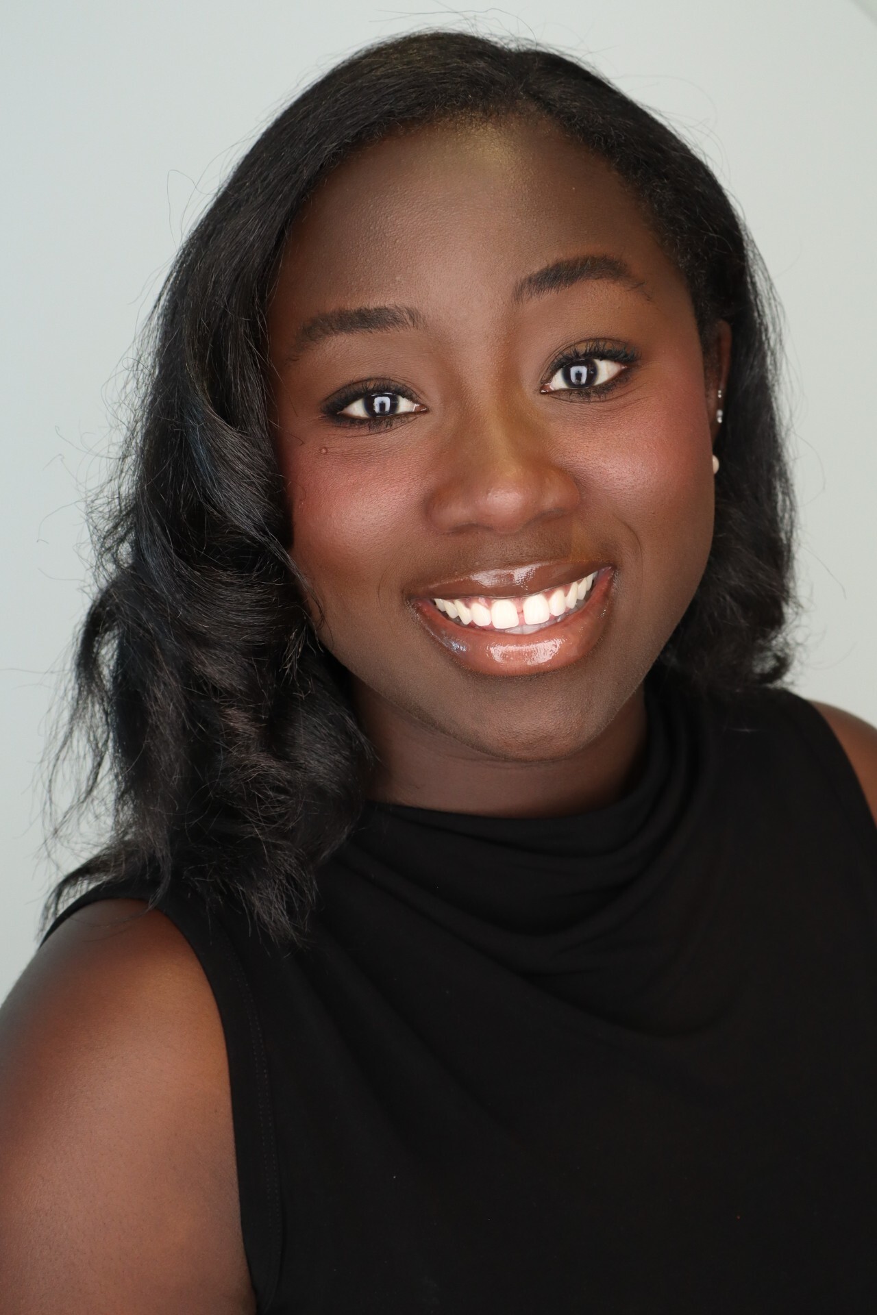 Woman smiling in black dress