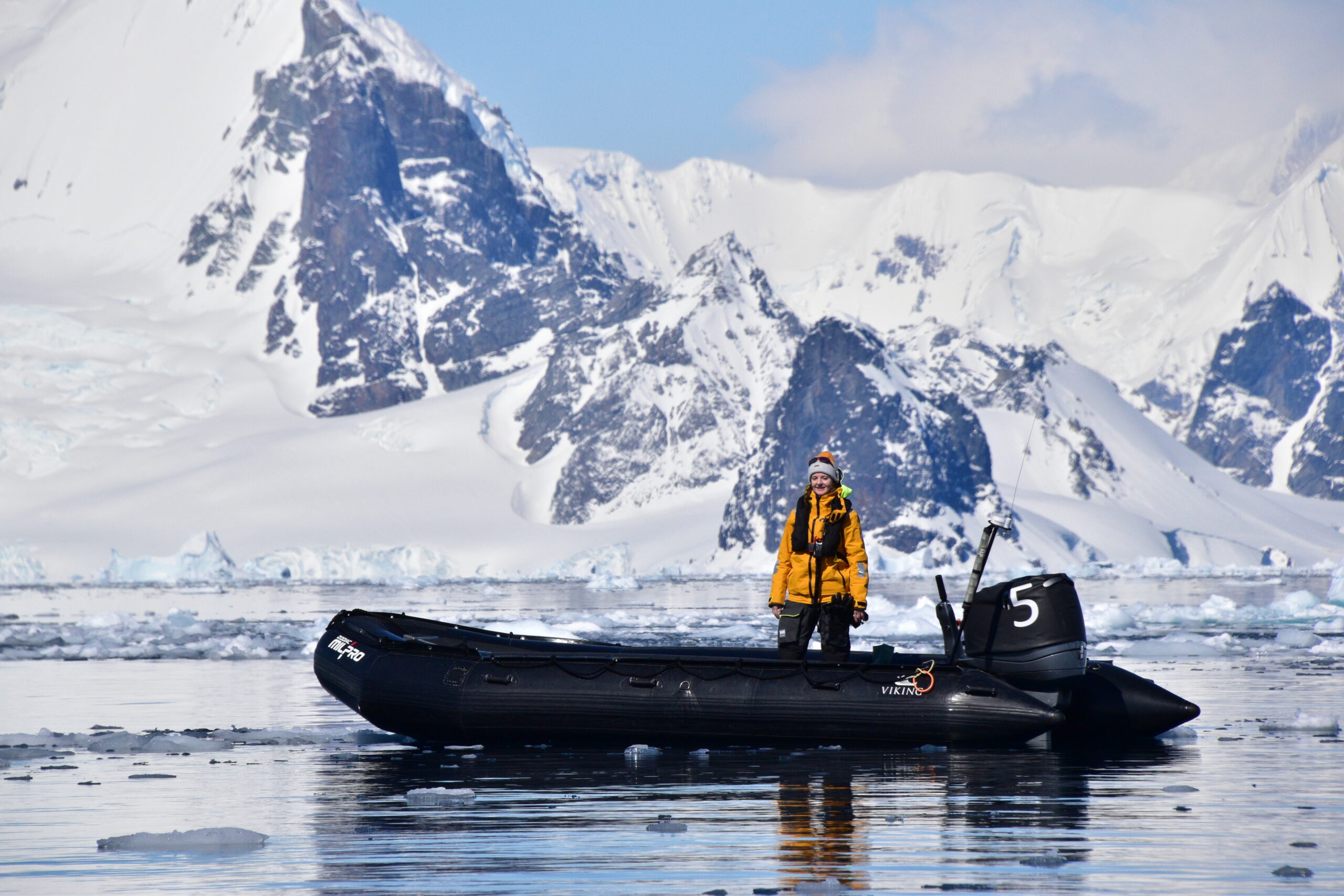 Woman on dinghy in icy setting
